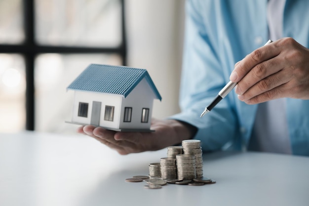 Person with stack of coins saving money concept for future use and financial stability savings for housing payroll management personal finance investment savings