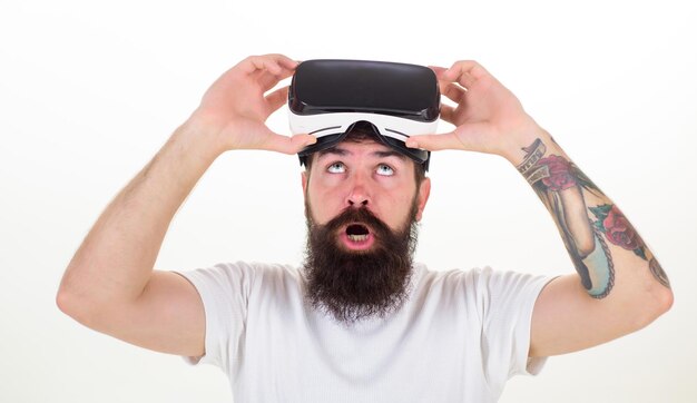 Person with virtual reality helmet isolated on white background Happy bearded man wearing virtual