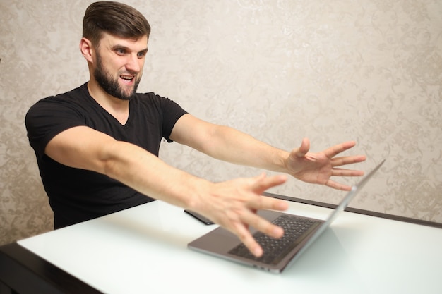 a person working at a computer shows hand gestures