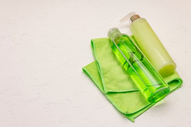 Personal care at home. Gel and tonic water with green tea, bath towel. Natural ingredient spa concept