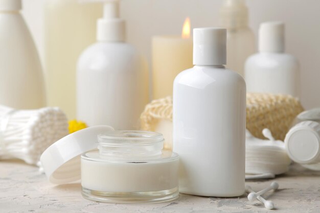 Personal hygiene products. Body care cosmetics. White bottles and vials on a light background. SPA. Relax.