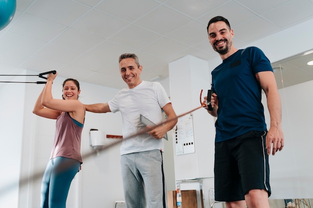 Personal trainer in his 40s and his young sporty clients