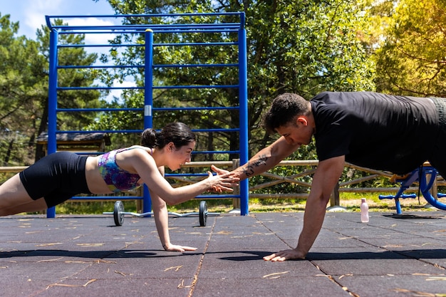 Personal training teamwork with pushup challenge