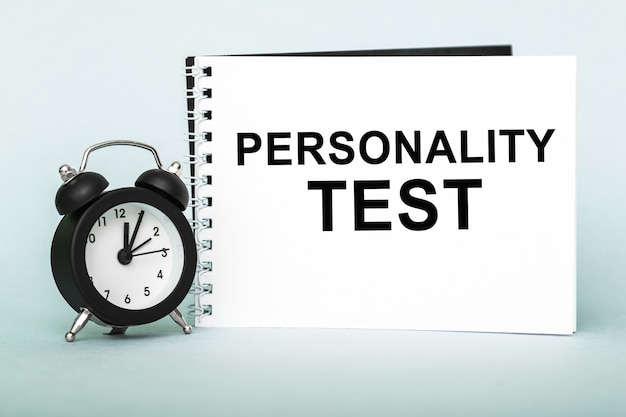 Personality test. Notebook with text on blue background.