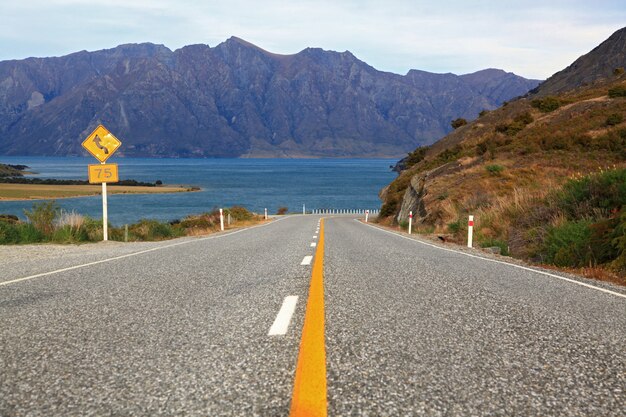 Perspective of highway road freeway to lake Hawea in Wanaka New Zealand