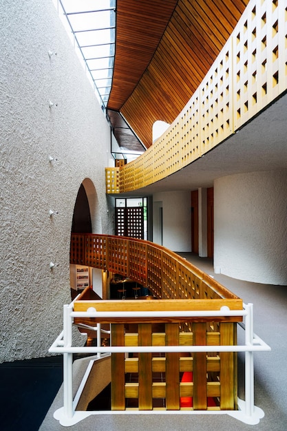 Perspective of luxury stairs at hotel in italy. modern italian\
office interior with staircase. home or house design. room\
architecture with wooden background. indoor and nobody inside.\
empty floor.