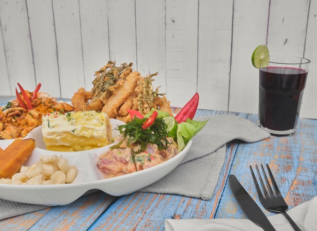 Photo peruvian food ronda marina a varied seafood classic ceviche rice with seafood fried fish causa