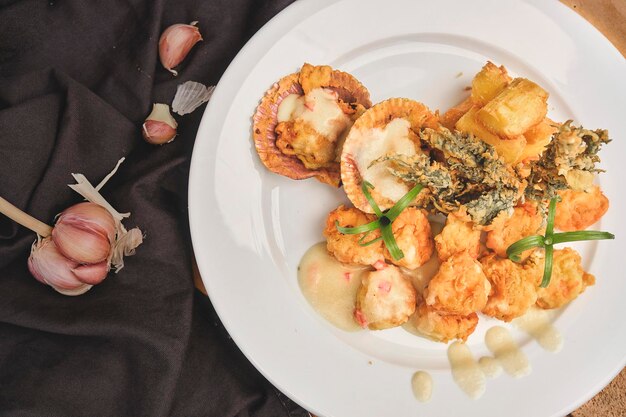 Peruvian food Sauteed Shrimp with Herbs and Garlic wooden table served on a white plate