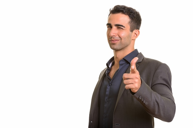 Perzische zakenman die duim opgeeft terwijl hij knipoogt