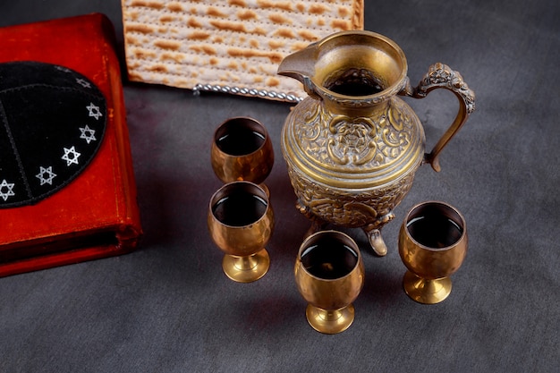 Pesach Passover symbols of great Jewish holiday. Traditional matzah and wine glass.