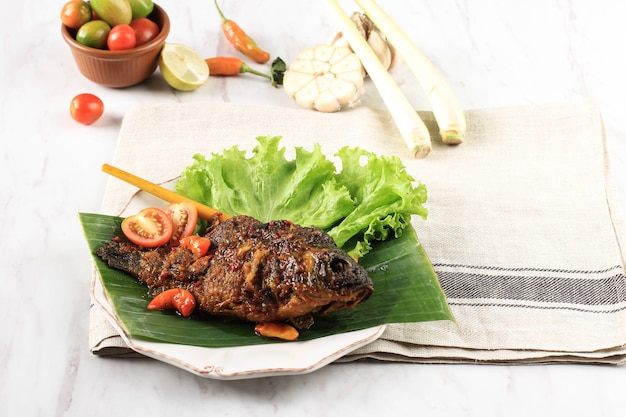 Pesmol Fish Using Goldfish. Add Fried Fish to the Pan. Pesmol Typically Fish Recipe from West Java, Indonesia, with Sweet, Sour, and Spicy Taste