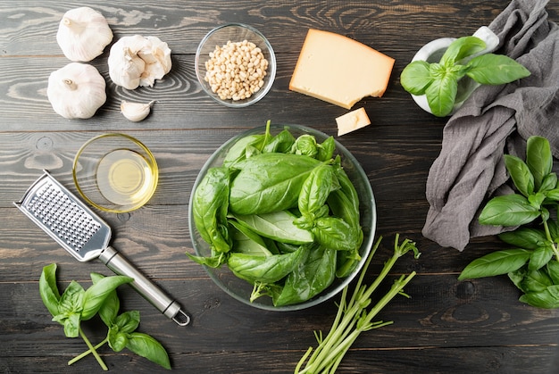 Pesto Sauce. Italian Cuisine. preparing italian pesto sauce, basil and ingredients on black table