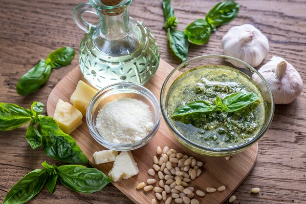 Pesto with ingredients on the wooden table