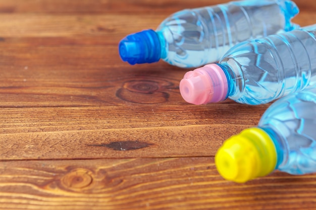 PET bottles of water on empty table