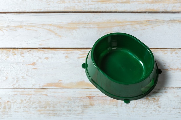 Pet bowl on a grey wooden table