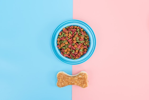 Pet food and snack with copy space on color background