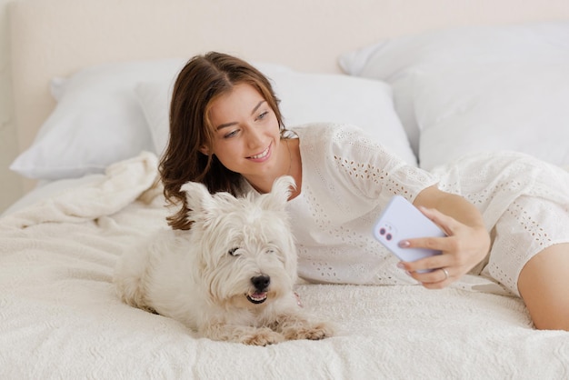 pet love concept girl at home holding a dog in her arms