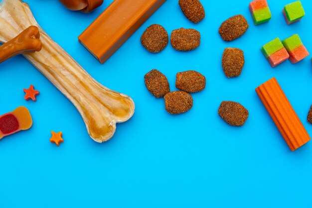 Photo pet snacks for dogs on blue background