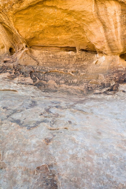 Petroglyphs on sandstone rock in wadi rum desert