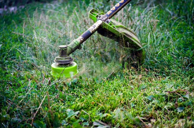 Petrol cutter trimmer in operation