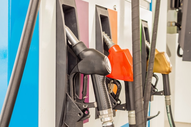 Petrol filling nozzles at gas station pump