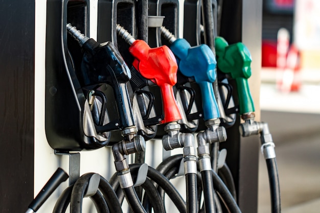 Petrol fuel pumps for filling the car at a gas station in the city.