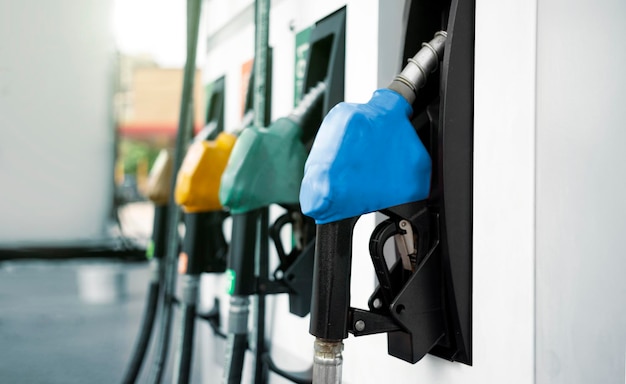 Petrol pump filling nozzles isolated on white background Gas station in a service