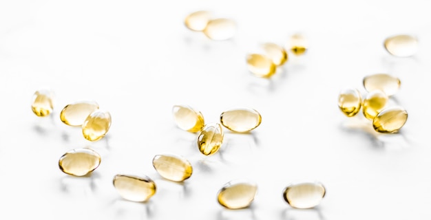 Pharmaceutical branding and science concept  vitamin d and golden omega  pills for healthy diet nutr...