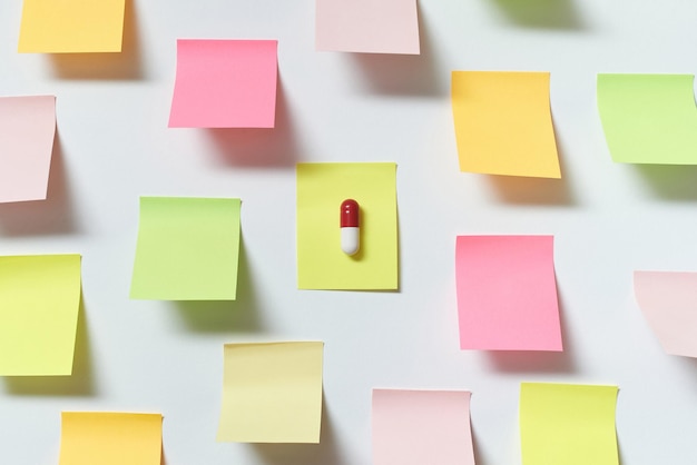 Pharmaceutical pill on sticky note