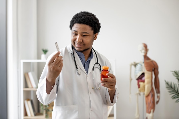 Pharmacist scanning pill bottle in doctor's workplace