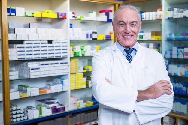 Pharmacist standing with arms crossed