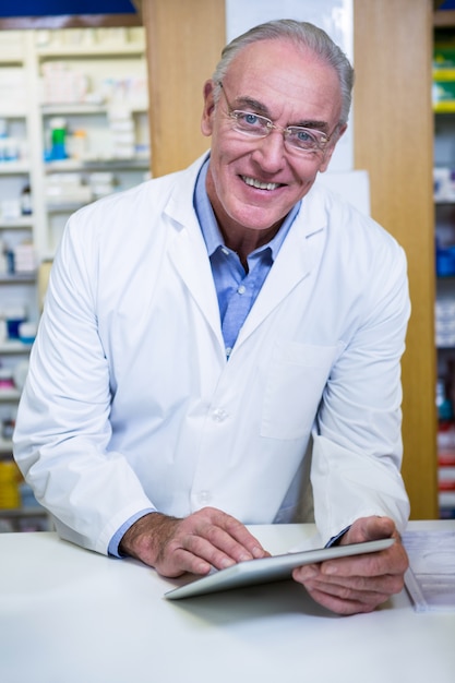 Pharmacist using a digital tablet