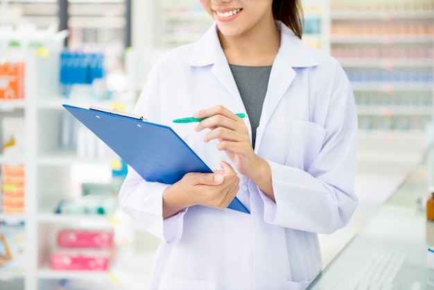 Pharmacist working in chemist shop or pharmacy