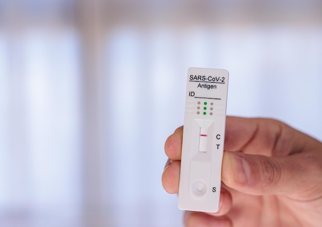 Pharmacy antigen test in hand, negative result