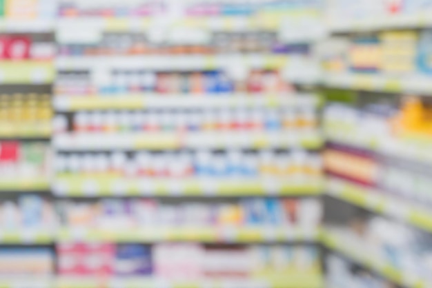 Pharmacy drugstore shop interior shelves blur background