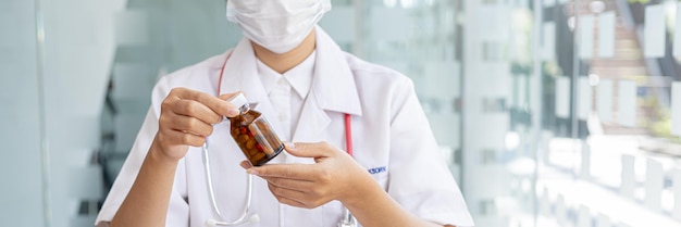 Pharmacy is holding a bottle a public health professional with the most expertise in medicine in the health profession responsible for all medicines their procurement production and distribution