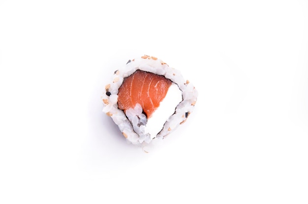 Philadelphia uramaki sushi with raw salmon and cream cheese top view isolated on white background