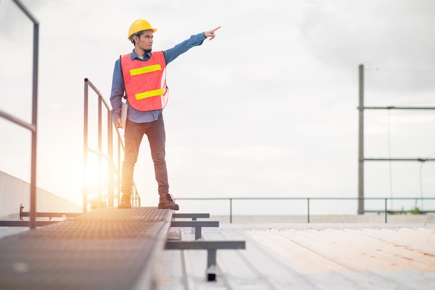 Philippines Asian man worker engineer working on rooftop factory plant