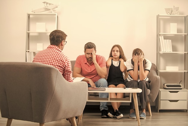 Phone addicted father mother and child at family psychologist consultant