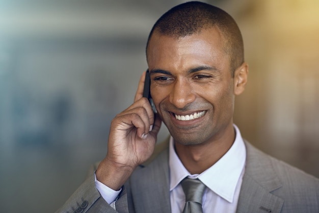 Phone call business and happy man in communication networking and contact feedback or legal advice Professional indian person or corporate lawyer listening and talking on mobile chat with client