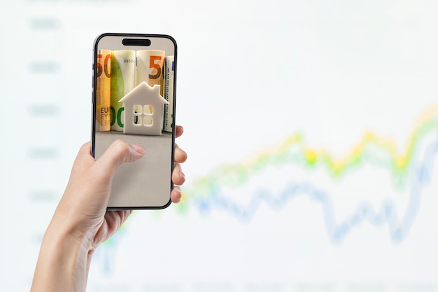 Phone in hand against the background of investment chart investment concept broker services real estate value economic growth dividend payout copy space