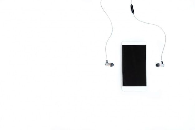 Phone and headphones on a white background