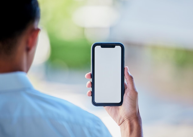 Phone screen and mockup in the hand of a person for website marketing on advertising on space Mobile logo or branding on a display for contact communication or networking in ecommerce or sales