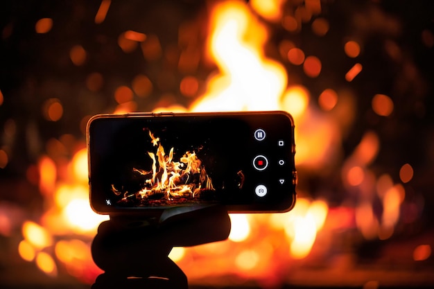 The phone on the tripod shoots the fireb