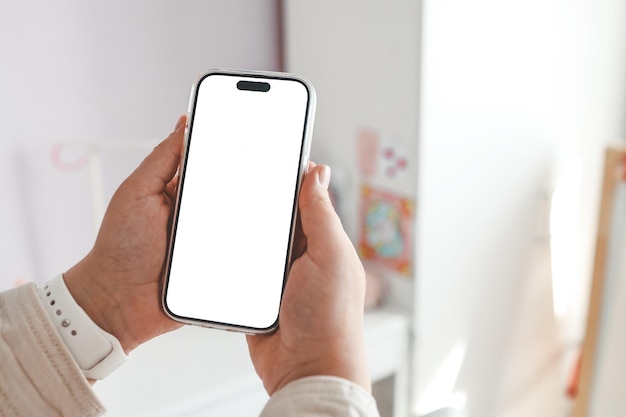 Phone with an insulated screen in the children's room against the background of a bunk bed order furniture