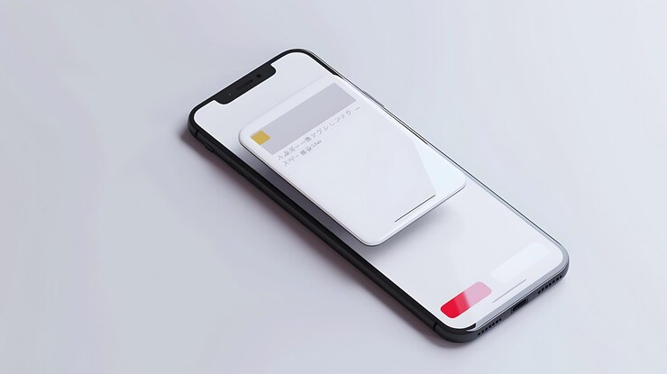 Photo a phone with a red light on the screen is laying on a grey surface