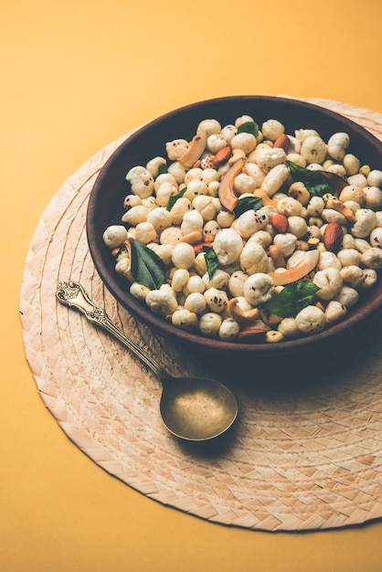 Phool Makhana Chivda is a crunchy healthy snack from india, perfect for teatime. Served in a bowl or plate. Selective focus