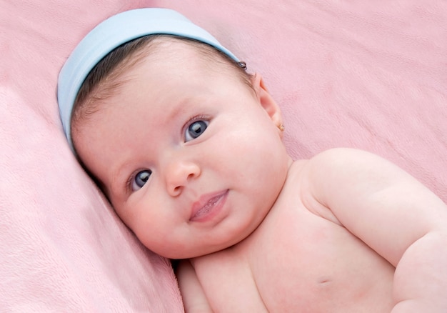 Photo of adorable baby newborn with blue eyes