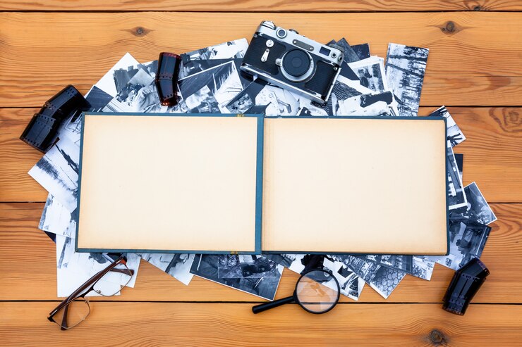 Photo album with a retro camera on the table