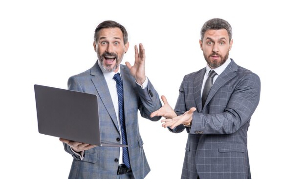 Photo of amazed businessmen freelancer with laptop two businessmen freelancer using laptop